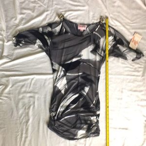 NWT black/white/grey cold shoulder dress with metal like accents.